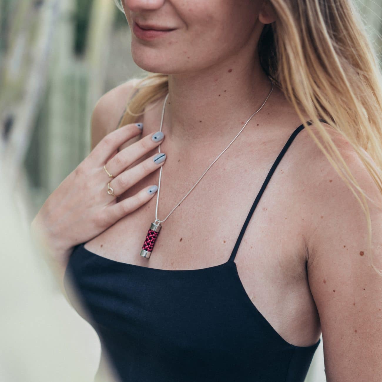 Woman wearing rope pendant necklace